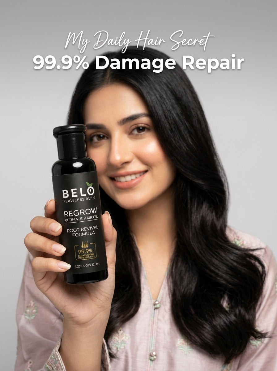 Woman holding a Belo Regrow Ultimate Hair Oil bottle.